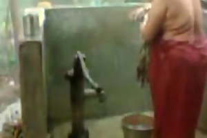 big beautiful latitudinarian indian bhabhi taking shower from pump
