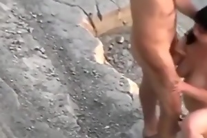 Voyeur tapes a naturist coupler fucking in public near eradicate affect rocks
