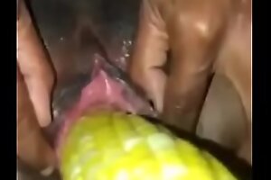 ebony girl gets her pussy stretch with a corn